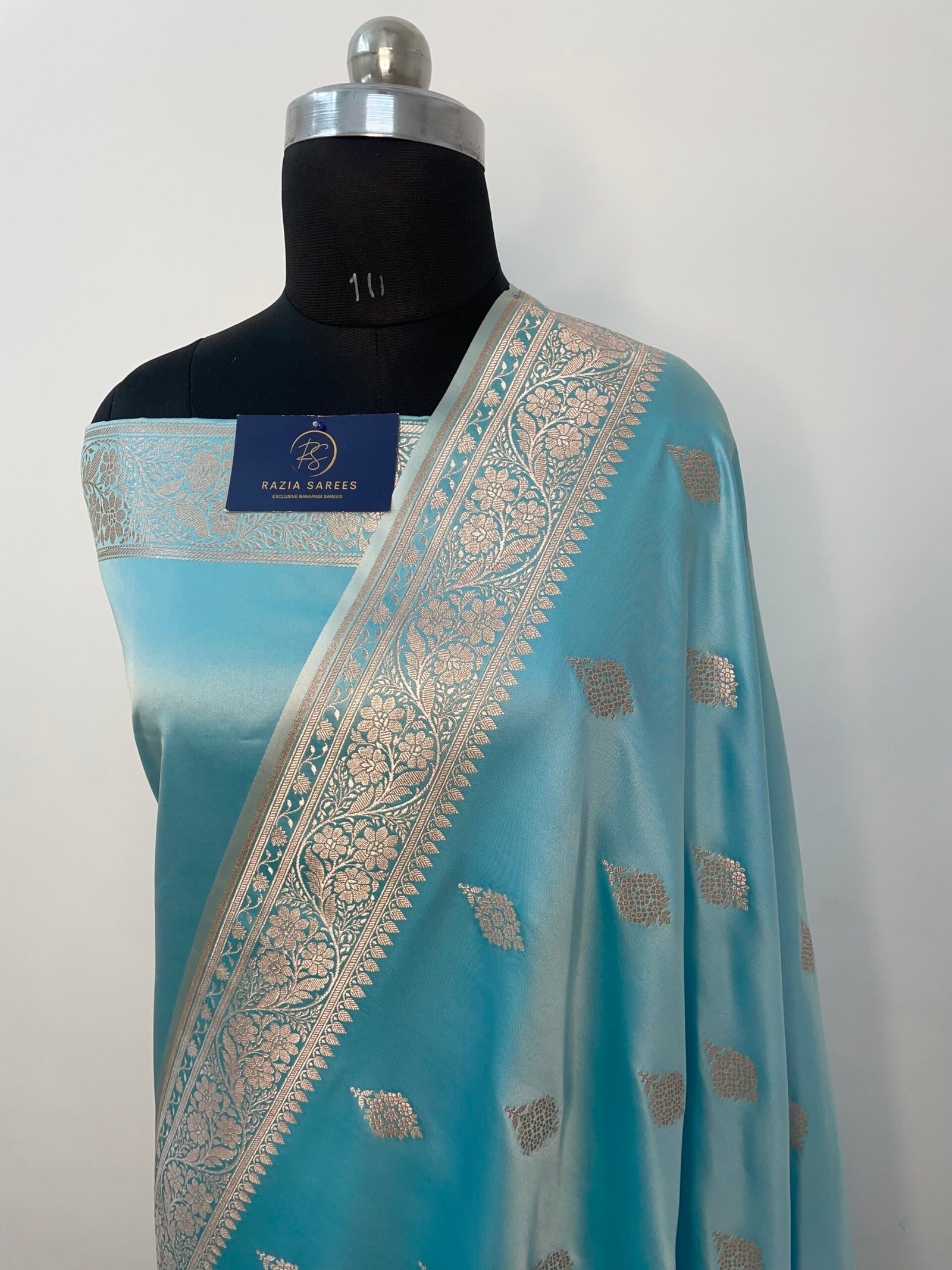 A. Ivory Firozi Booti Mashru Katan Silk Saree